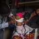 Beatrice, 1, getting a checkup in Yola, Nigeria, where thousands of children died every year from pneumonia.